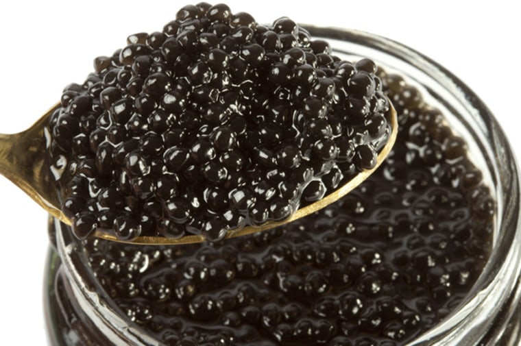 Bank with black caviar on a white background.